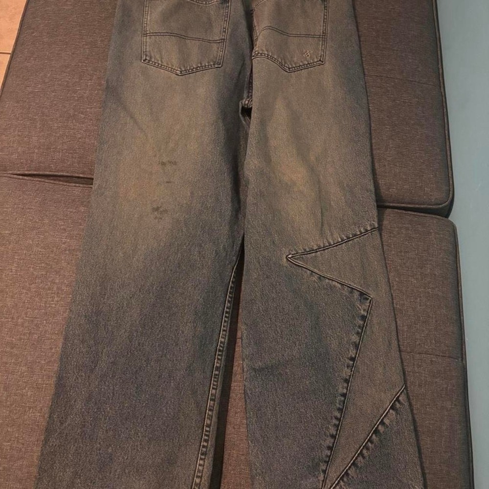 Baggy blue Sean John jeans with a distressed look  Size 38x32